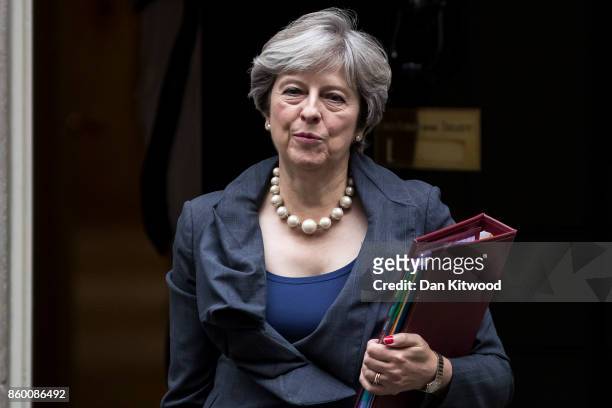 British Prime Minister Theresa May leaves 10 Downing Street to attend the weekly Prime Ministers Questions on October 11, 2017 in London, England.