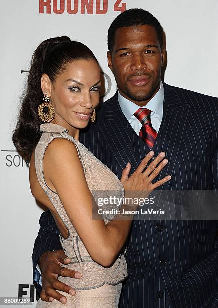 Actress Nicole Mitchell Murphy and NFL player Michael Strahan attend the premiere of "Tyson" at the Pacific Design Center on April 16, 2009 in West...