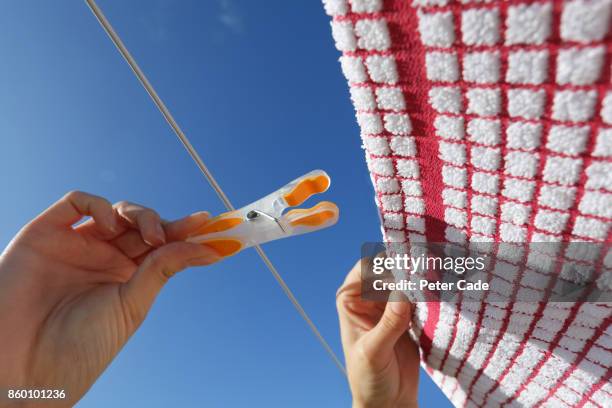 tea towel being pegged on washing line - devonshire tea stock pictures, royalty-free photos & images