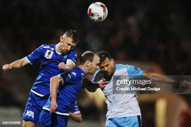 Deyvison Rogerio Da Silva of Sydney FC heads the ball against Michael Eagar of South Melbourne during the FFA Cup Semi Final match between South...