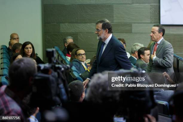 Spanish Prime Minister Mariano Rajoy leaves a press conference after making a statement, following a crisis cabinet meeting over the Catalonian...