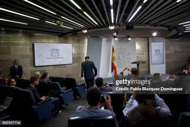 Spanish Prime Minister Mariano Rajoy arrives at a press conference to make a statement, following a crisis cabinet meeting over the Catalonian...