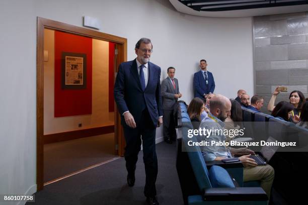 Spanish Prime Minister Mariano Rajoy arrives at a press conference to make a statement, following a crisis cabinet meeting over the Catalonian...