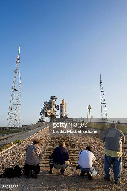 Space Shuttle Endeavour rolls atop the crawler transporter to Launch Pad 39-B in preparation for its upcoming mission at Kennedy Space Center on...