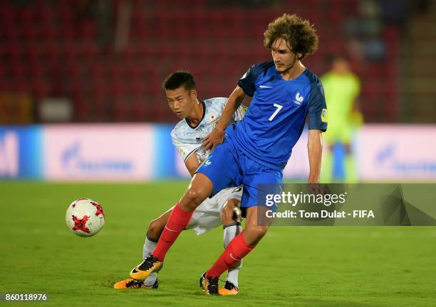 Hinata Kida of Japan and Yacine Adli of France battle for the ball during the FIFA U-17 World Cup India 2017 group E match between France and Japan...