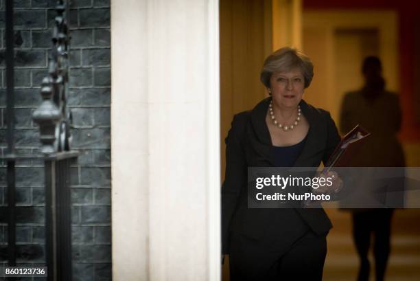 Britain's Prime minister, Theresa May leaves Downing Street to attend the weekly Question and Answer session at the Parliament, London on October 11,...