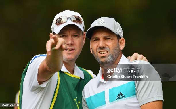 Sergio Garcia of Spain and his caddie Glenn Murray in discussion during the Pro Am tournament ahead of the Italian Open at Golf Club Milano - Parco...