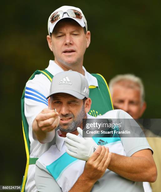 Sergio Garcia of Spain and his caddie Glenn Murray line up a shot during the Pro Am tournament ahead of the Italian Open at Golf Club Milano - Parco...