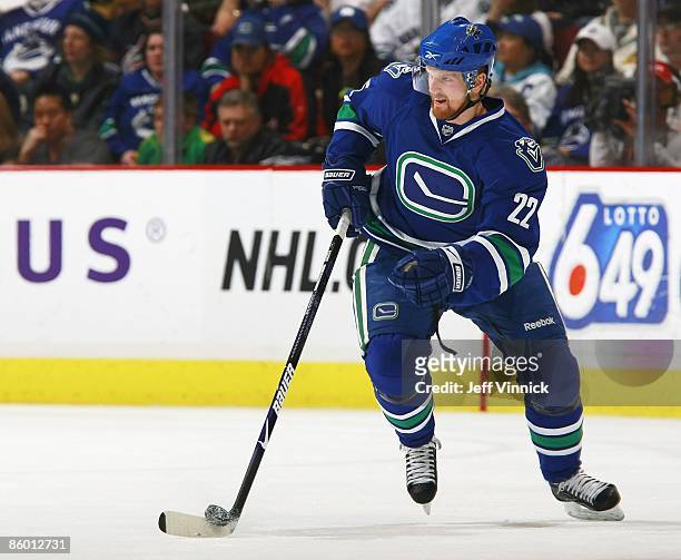 Daniel Sedin of the Vancouver Canucks skates up ice with the puck during the game against the Colorado Avalanche at General Motors Place on April 5,...