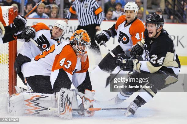 Forward Matt Cooke of the Pittsburgh Penguisn skates in on goaltender Martin Biron of the Philadelphia Flyers during game one of the 2009 Eastern...