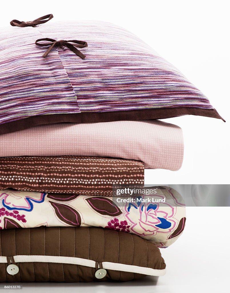 Stack of Folded Sheets and Pillows