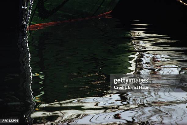 Distorted reflection on rippling water, June 1962.