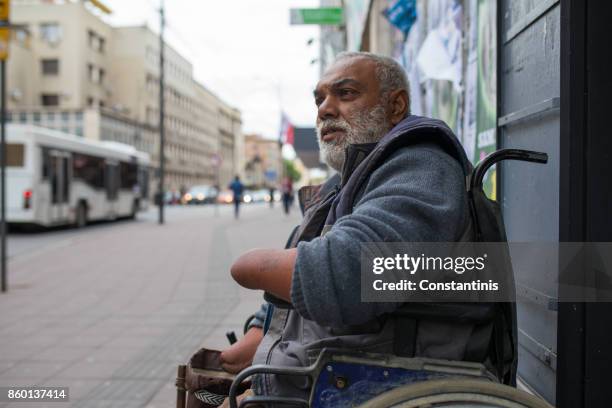 poor disabled man asked money on street - beggar stock pictures, royalty-free photos & images