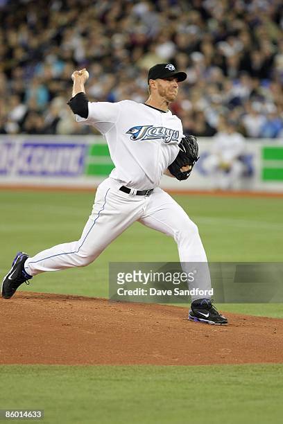 Roy Halladay of the Toronto Blue Jays delivers the pitch during the Opening Day game against the Detroit Tigers at the Rogers Centre on April 6, 2009...