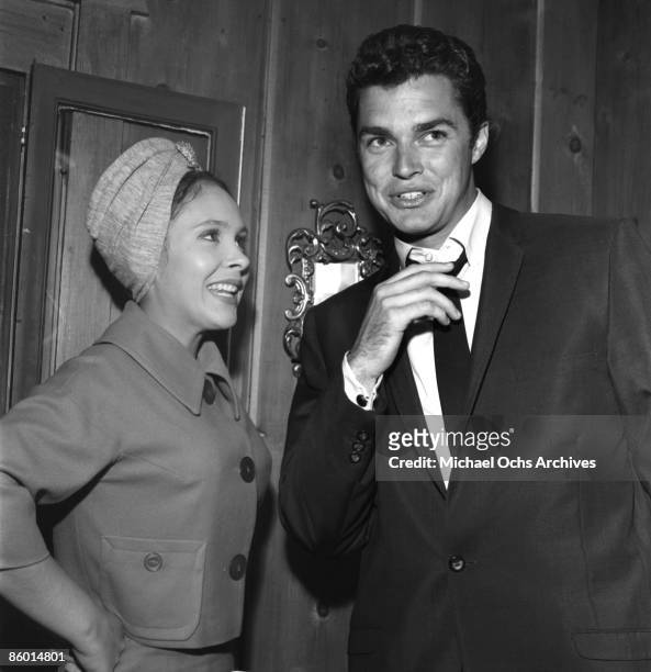 Fledgling actress Darbi Winters poses with actor Richard Beymer at a young Hollywood party in 1962 in Los Angeles, California.