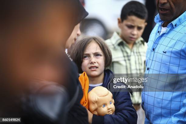 Syrian girl is seen on International Day of the Girl Child as Syrians, who went to their hometowns for Eid al-Adha, continue to return to Turkey at...