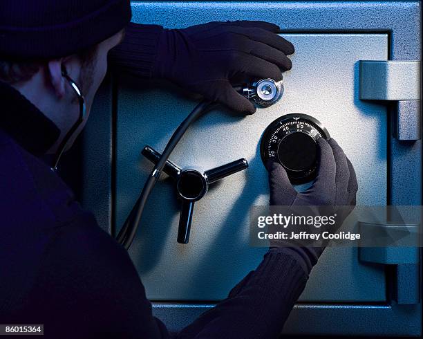 man breaking into safe - stealing idea stock pictures, royalty-free photos & images