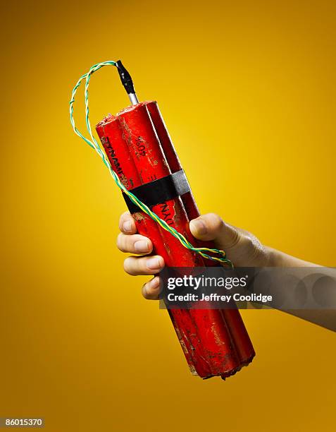 woman holding dynamite - explosive stock pictures, royalty-free photos & images