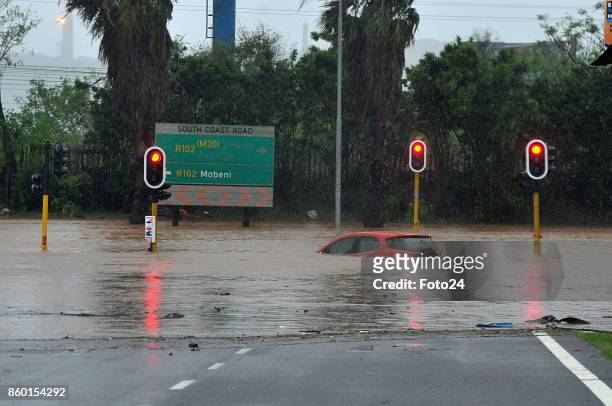 Cars are seen semi-submerged on the Durban roads during severe floods on October 10, 2017 in Durban, South Africa. The heavy flash floods in KZN have...