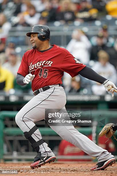 Carlos Lee of the Houston Astros swings at the pitch during the Opening Day game against the Pittsburgh Pirates at PNC Park on April 13, 2009 in...