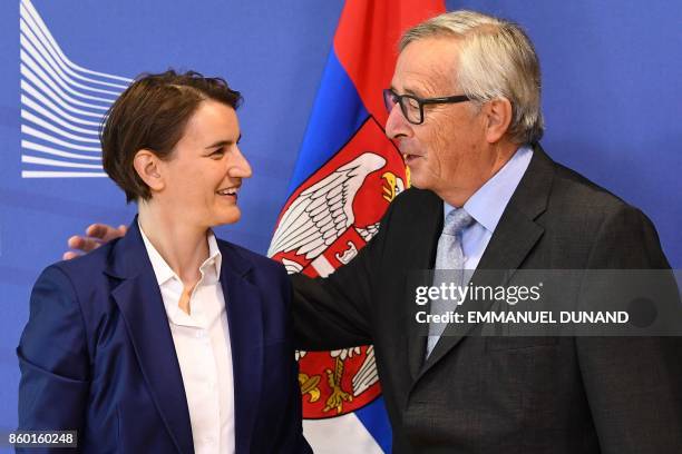 Serbia's Prime Minister Ana Brnabic is welcomed by European Commission President Jean-Claude Juncker at the European Commission in Brussels on...