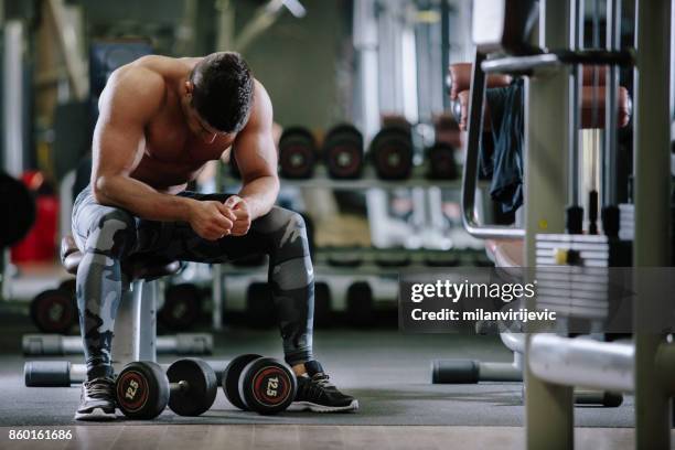 muscular fit man exercising in a gym - arab bodybuilder stock pictures, royalty-free photos & images