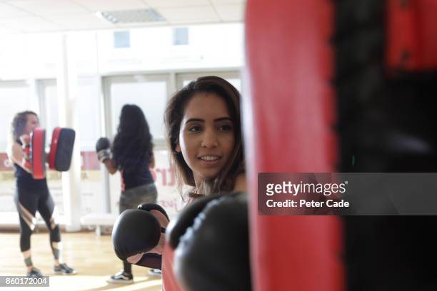 young mixed race women in gym boxing - mixed boxing bildbanksfoton och bilder