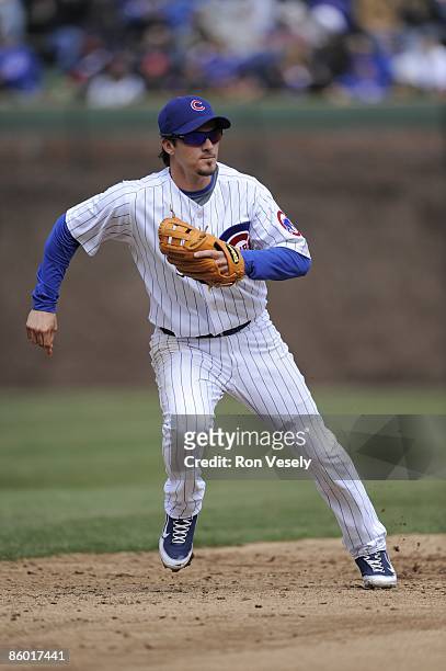 Ryan Theriot of the Chicago Cubs makes a move to field a ground ball against the Colorado Rockies on April 15, 2009 at Wrigley Field in Chicago,...