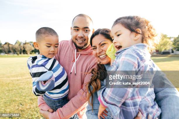 family  with two kids - toddlers playing outdoor stock pictures, royalty-free photos & images