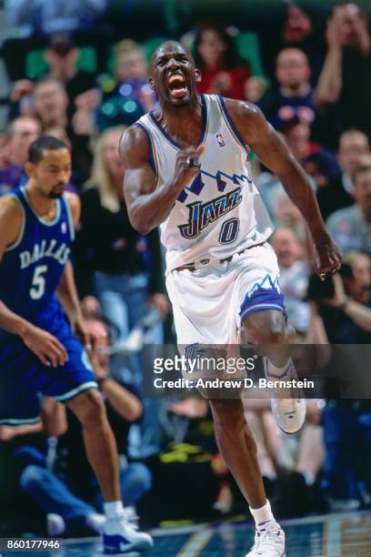 Olden Polynice of the Utah Jazz celebrates during Game Five of the First Round of the 2001 NBA Playoffs on May 3, 2001 at the Delta Center in Salt...