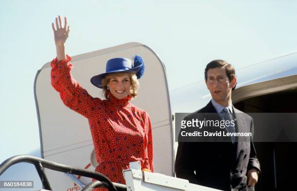 Diana Princess of Wales and Prince Charles wave goodbye as they leave Melbourne Airport on April 17, 1983 in Melbourne, Australia at the end of their...