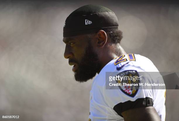 Lardarius Webb of the Baltimore Ravens looks on during pregame warm ups prior to the start of an NFL game against the Oakland Raiders at...