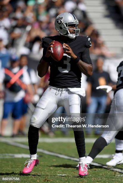 Manuel of the Oakland Raiders looks to pass against the Baltimore Ravens during the second quarter of their NFL football game at Oakland-Alameda...