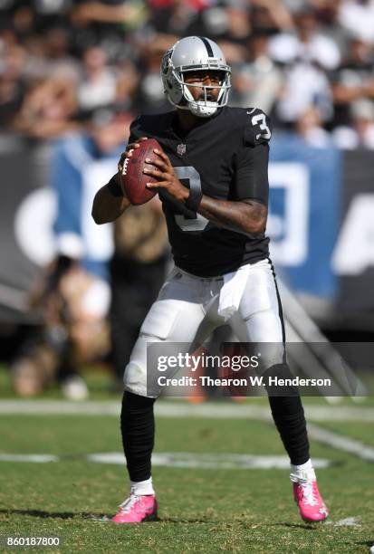 Manuel of the Oakland Raiders looks to pass against the Baltimore Ravens during the second quarter of their NFL football game at Oakland-Alameda...