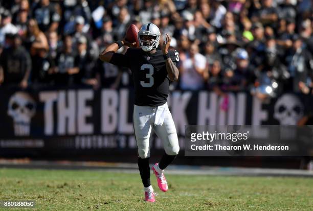 Manuel of the Oakland Raiders throws a pass against the Baltimore Ravens during the third quarter of their NFL football game at Oakland-Alameda...