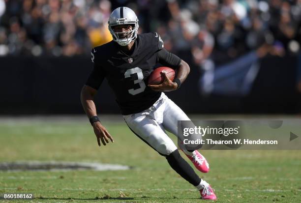 Manuel of the Oakland Raiders runs with the ball against the Baltimore Ravens during the third quarter of their NFL football game at Oakland-Alameda...