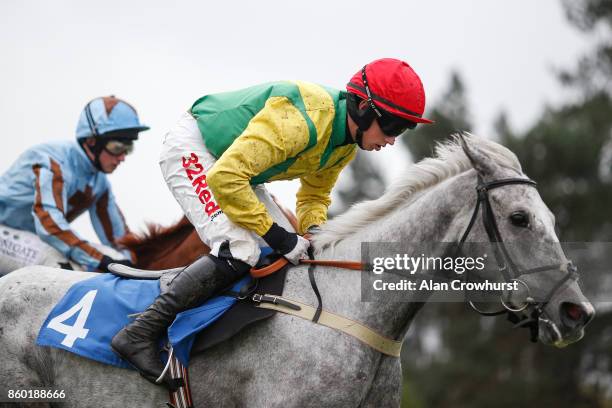 Jockey Bryan Cooper in the Ann & Alan Potts colours at Ludlow racecourse on October 11, 2017 in Ludlow, England.