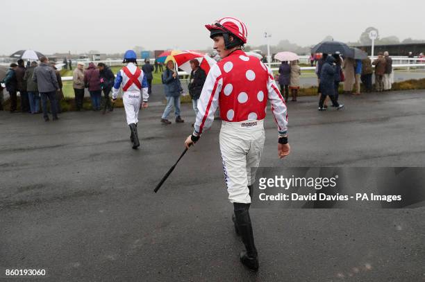 Jockey Harry Cobden makes his way out for the Queen Elizabeth Humanities College Racing To School Juvenile Maiden Hurdle at Ludlow Racecourse.