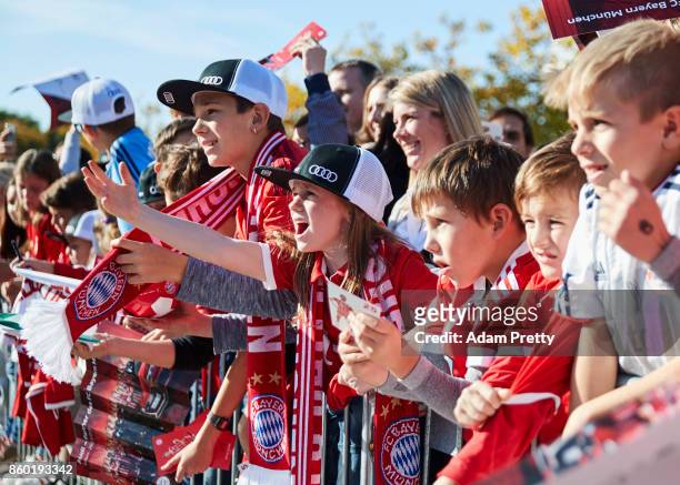 Fans scream for Thomas Mueller of Bayern Muenchen to sign some autographs during the FC Bayern Muenchen New Car Handover at the Audi Forum on October...