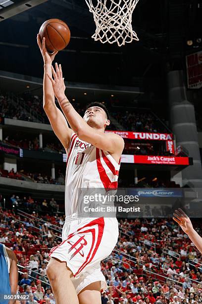 Yao Ming of the Houston Rockets lays up a shot during the game against the Minnesota Timberwolves on March 20, 2009 at the Toyota Center in Houston,...