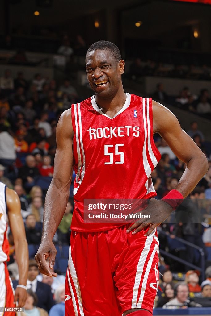 Mutamba Houston Rockets Dikembe Mutombo of the Houston Rockets looks on with a smile during ...