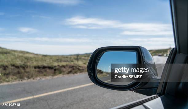 road reflecting on side-view mirror - wing mirror stock pictures, royalty-free photos & images