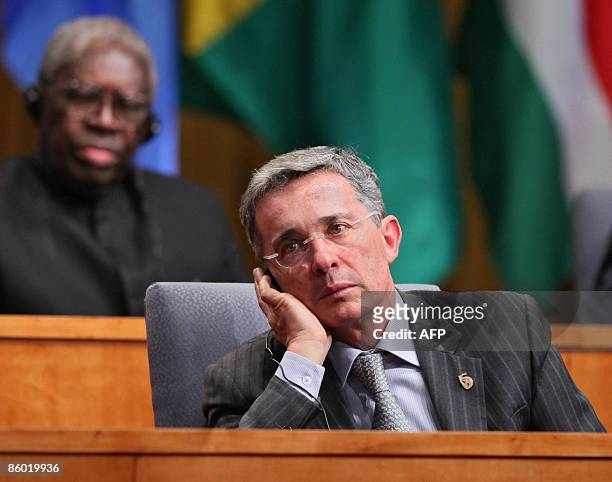 Colombia's President Alvaro Uribe listens a speech next to Suriname's President Ronald Venetiaan during the opening ceremony of the 5th Summit of the...