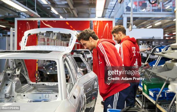 Mats Hummels and Javi Martinez inspect the Audi production line during the FC Bayern Muenchen New Car Handover at the Audi Forum on October 11, 2017...