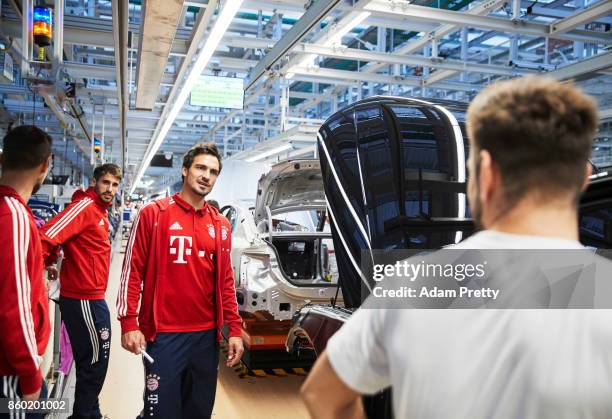 Mats Hummels of FC Bayern Muenchen inspects the Audi production line during the FC Bayern Muenchen New Car Handover at the Audi Forum on October 11,...