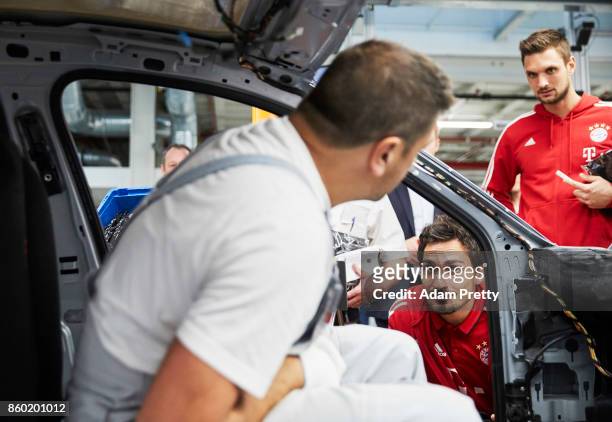 Mats Hummels and Sven Ulreich of FC Bayern Muenchen inspects the Audi production line during the FC Bayern Muenchen New Car Handover at the Audi...
