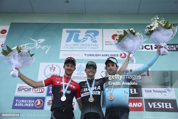 First place winner Irish cyclist Sam Bennett of Bora-Hansgrohe team, second place winner Edward Theuns of Trek-Segafredo and third place winner...