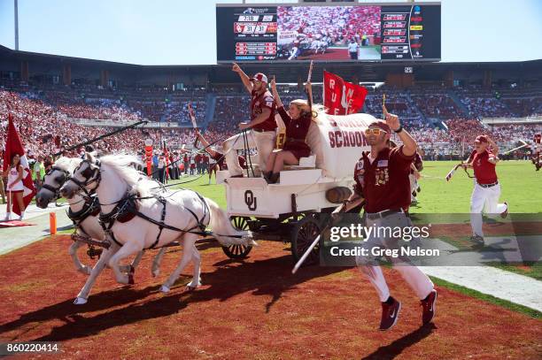 Oklahoma mascot Sooner Schooner on field with cheerleaders during game vs Iowa State at Gaylord Family Oklahoma Memorial Stadium. Norman, OK...