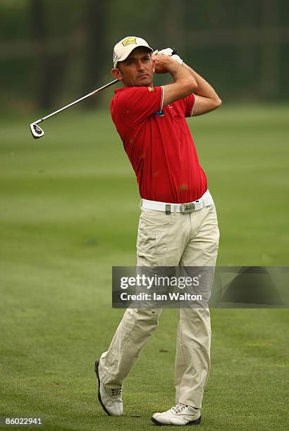 Markus Brier of Austria plays a shot during the 3rd round of the Volvo China Open at the Beijing CBD International Golf Club on April 18, 2009 in...