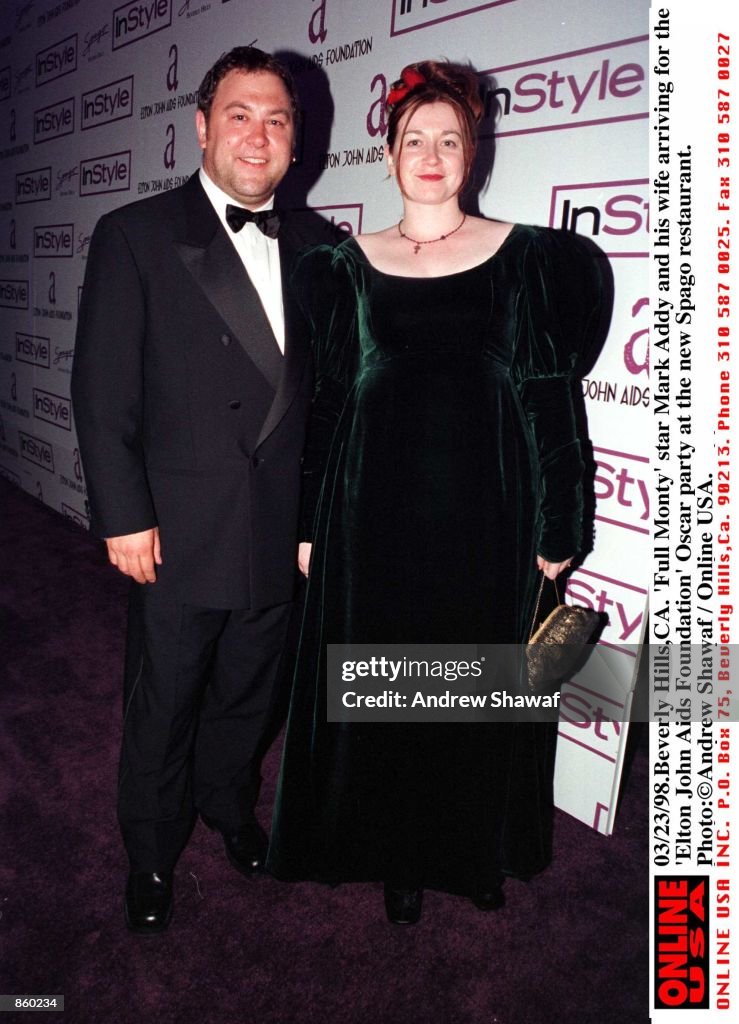 03/23/98 Beverly Hills, CA. "Full Monty" star Mark Addy and his wife arriving for the ''Elton John A